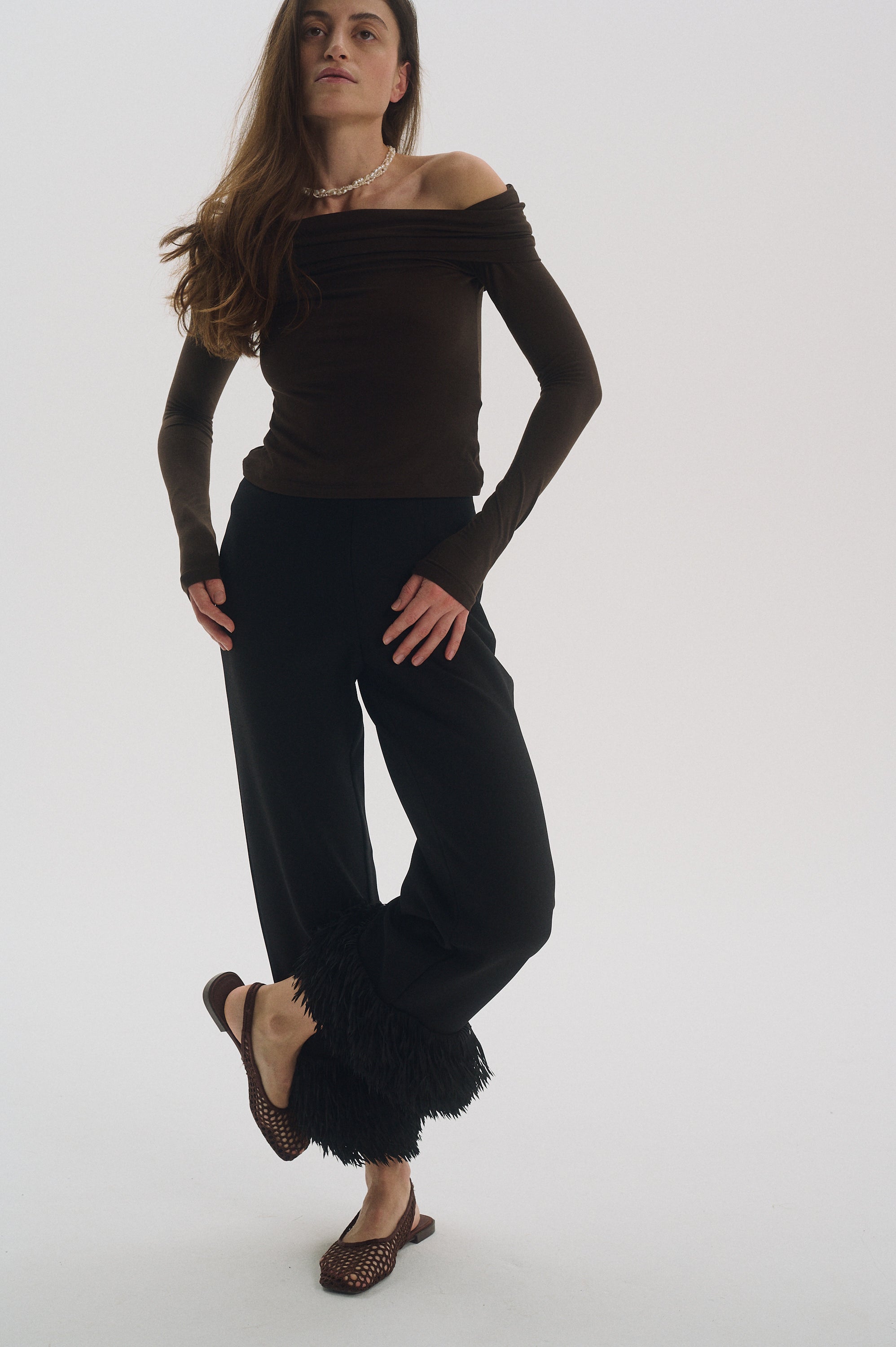 Full-body view with braided pearl necklace for evening look