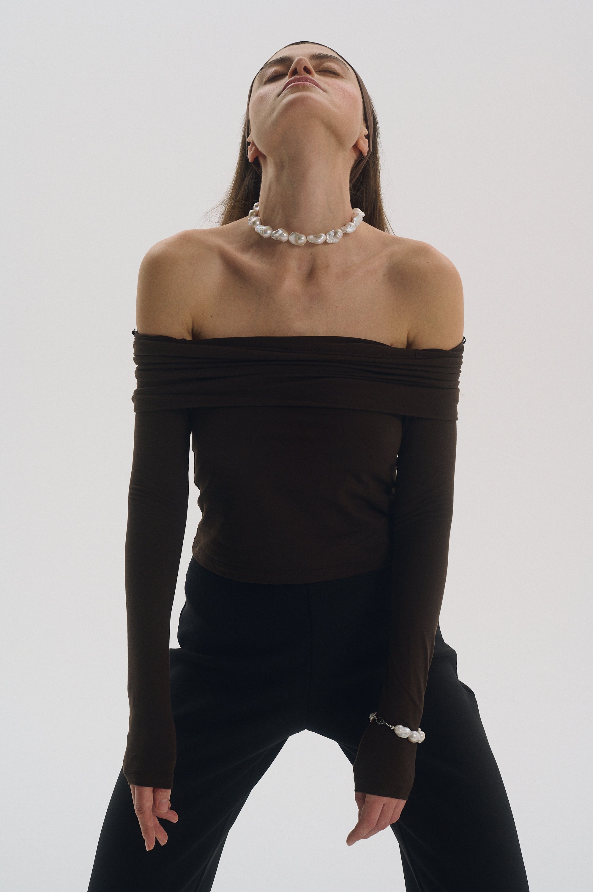 Baroque pearl choker with matching bracelet styled on woman