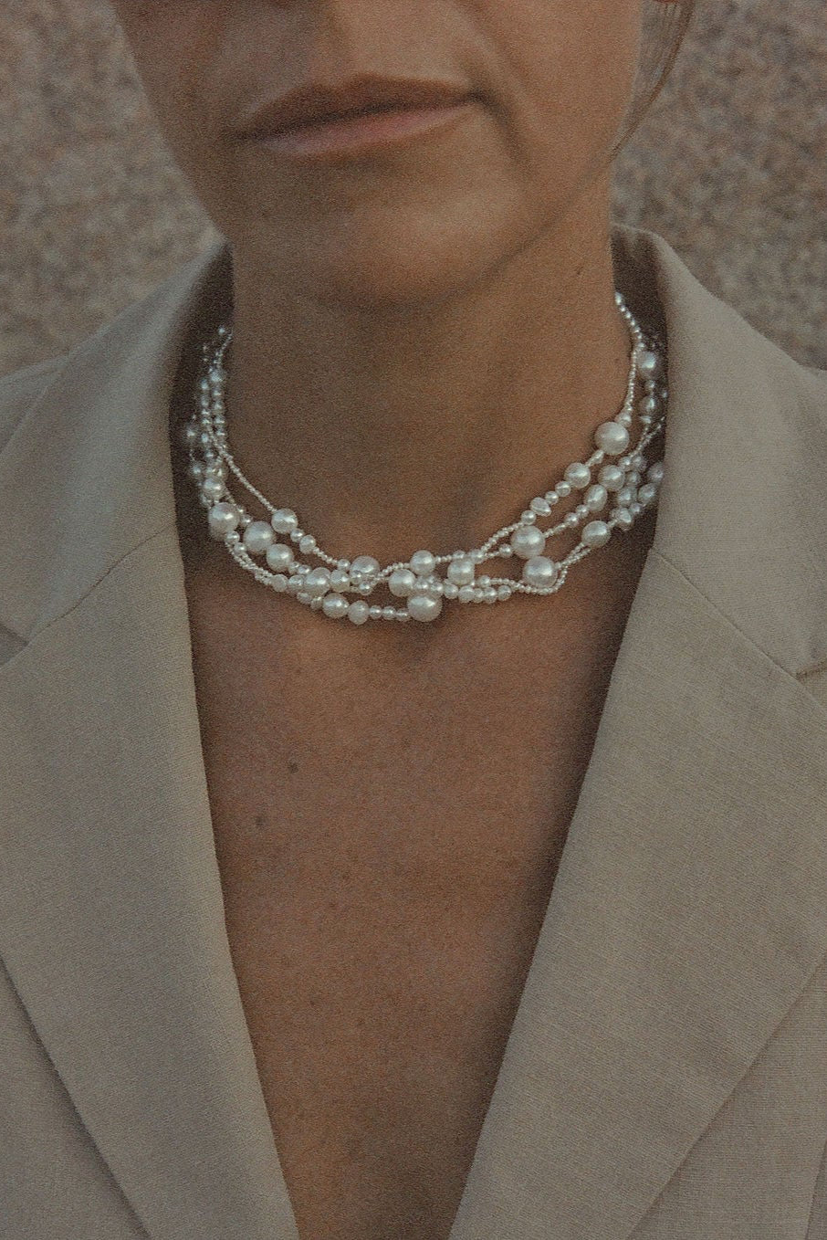 classic yet bold pearl necklace styled with minimal outfit