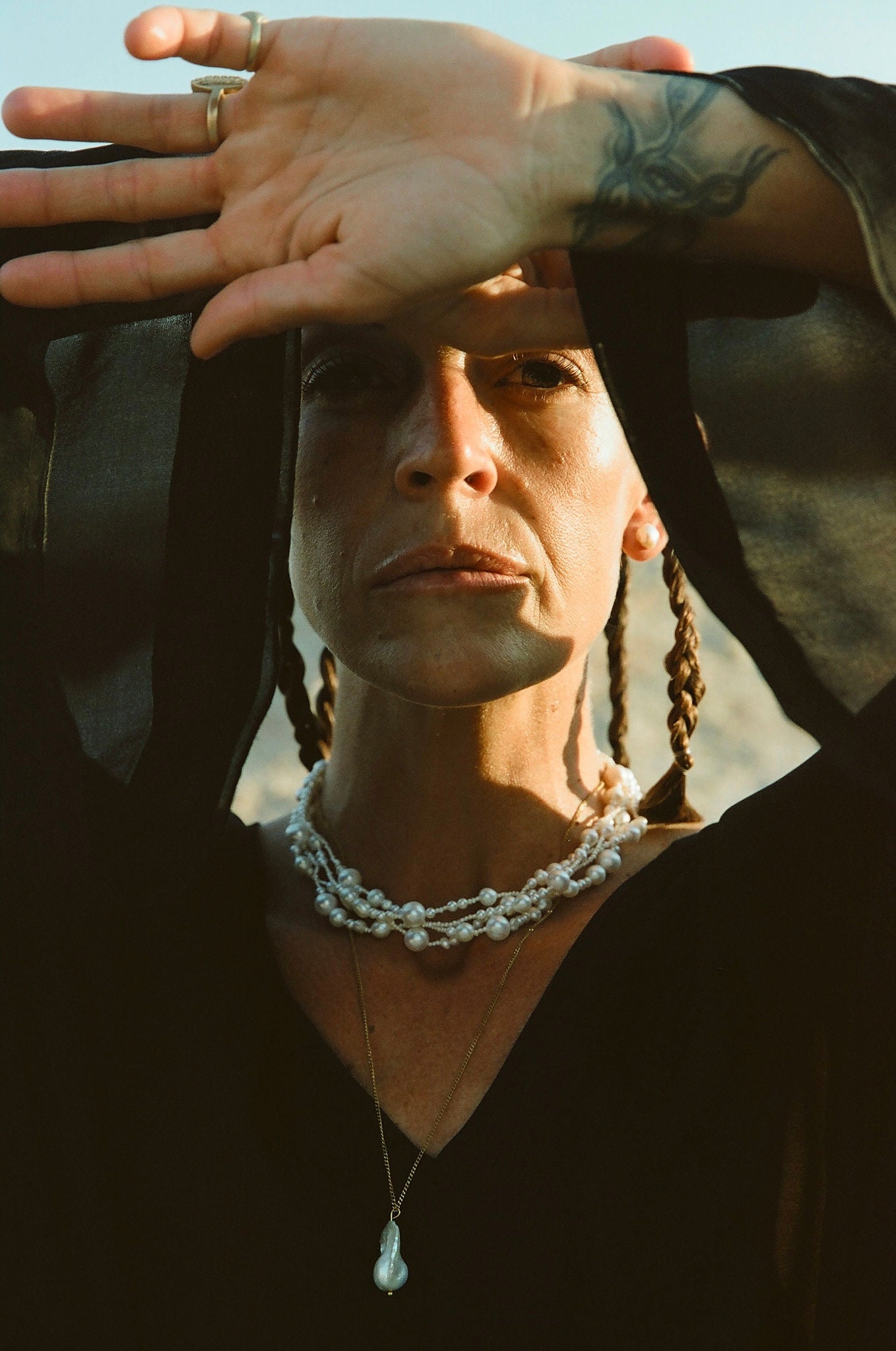 close-up of model’s neck with chunky layered pearl choker