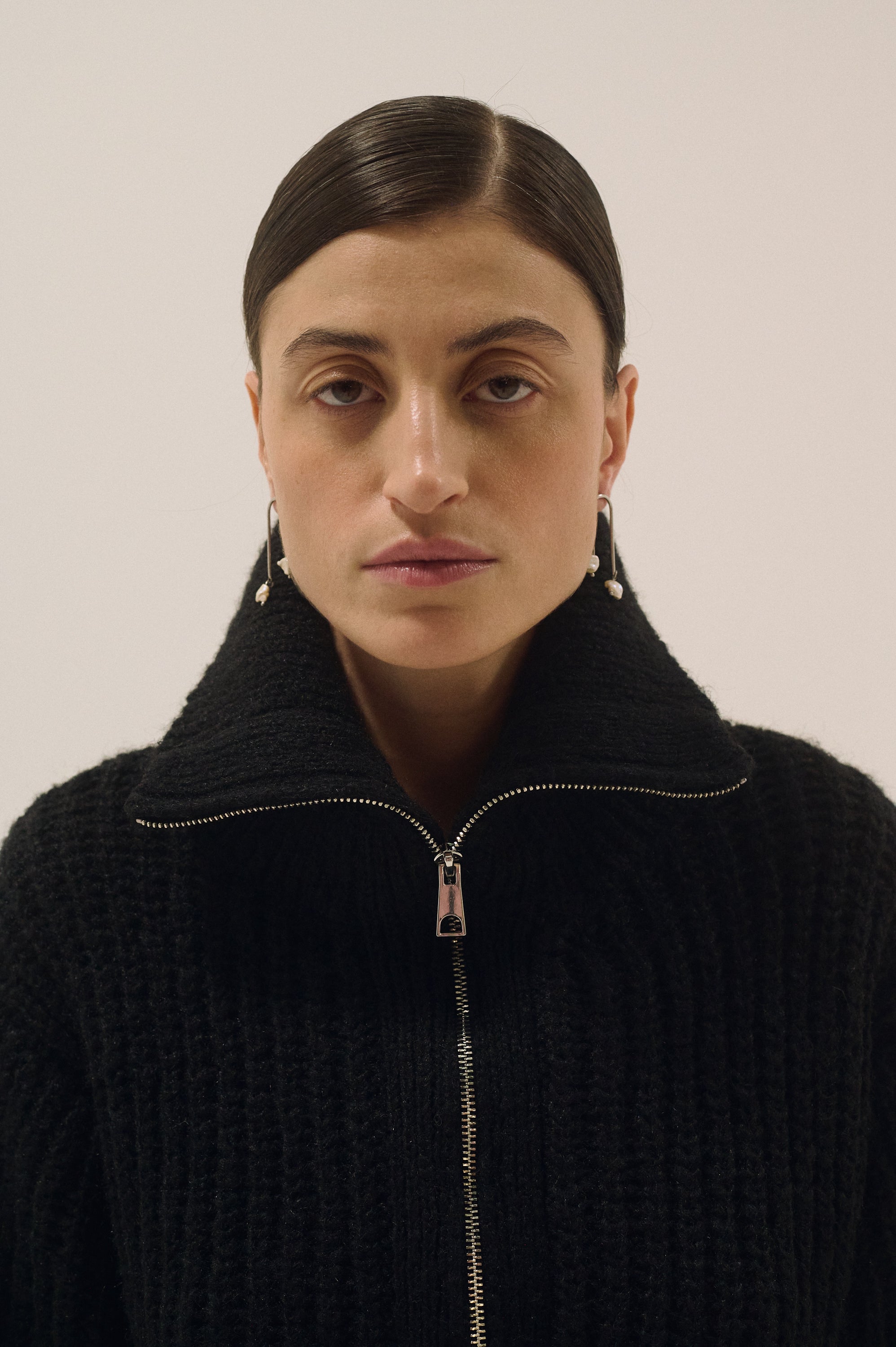 Model wearing long dangling Keshi pearl earrings