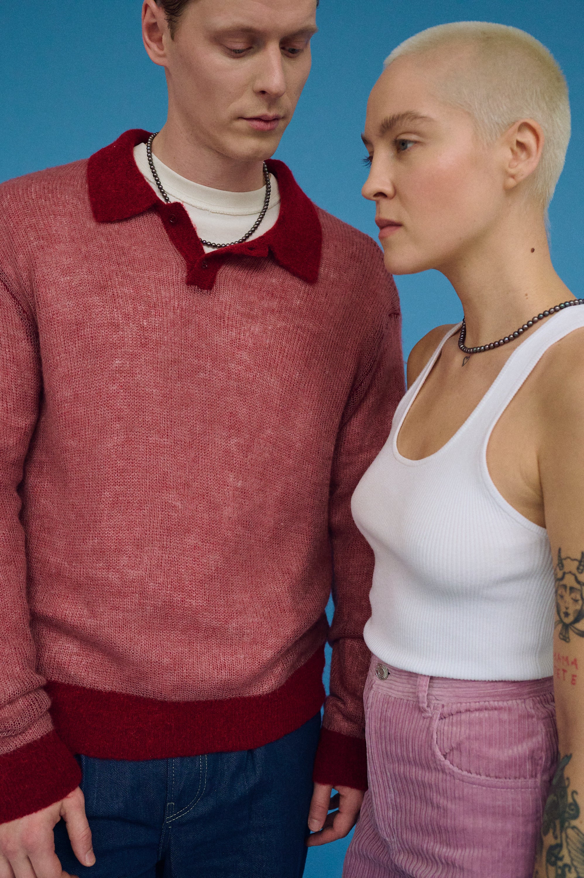 Close-up of couple dark pearl necklaces for him and her