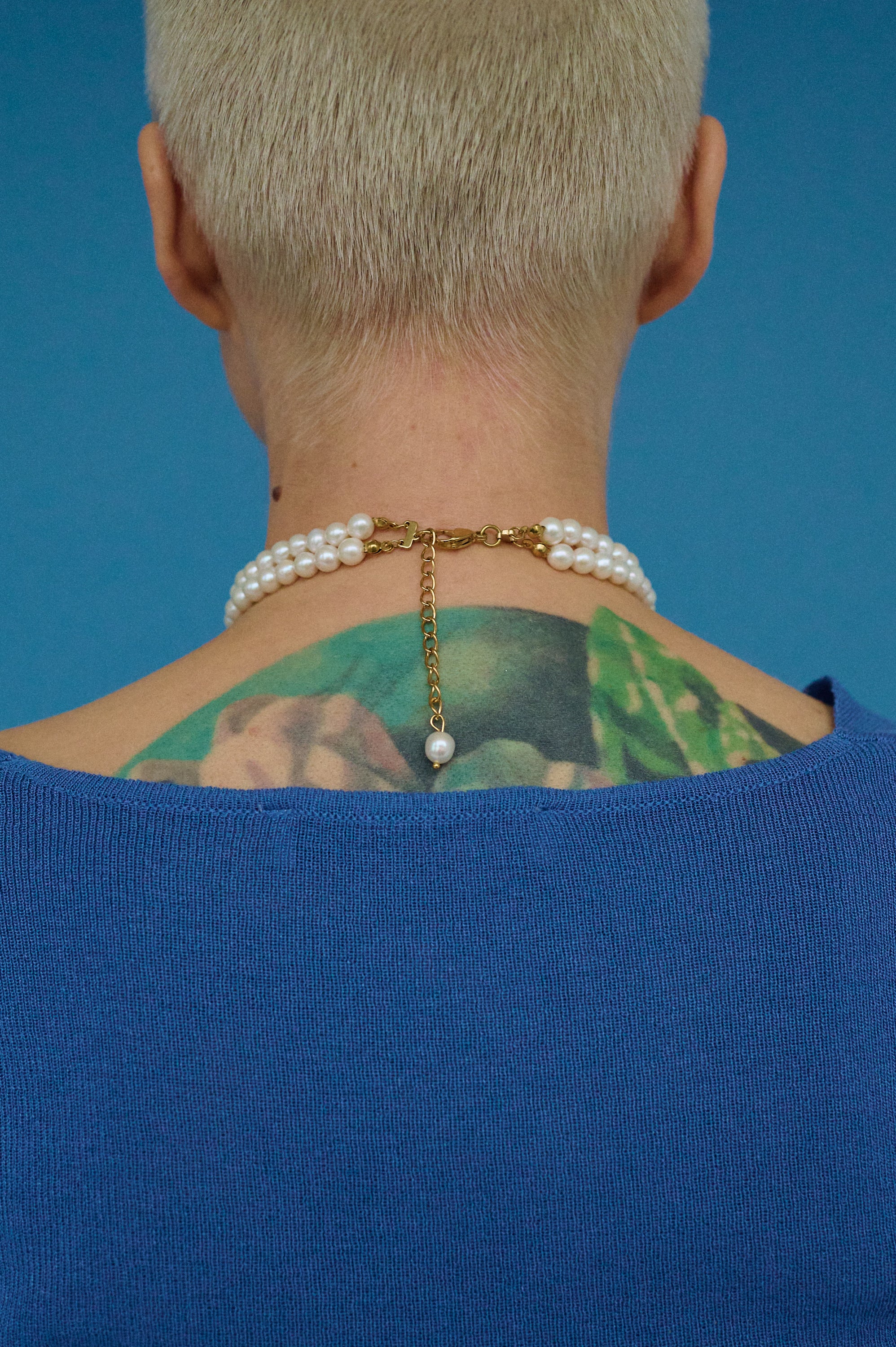 Back view of double pearl choker necklace with gold clasp