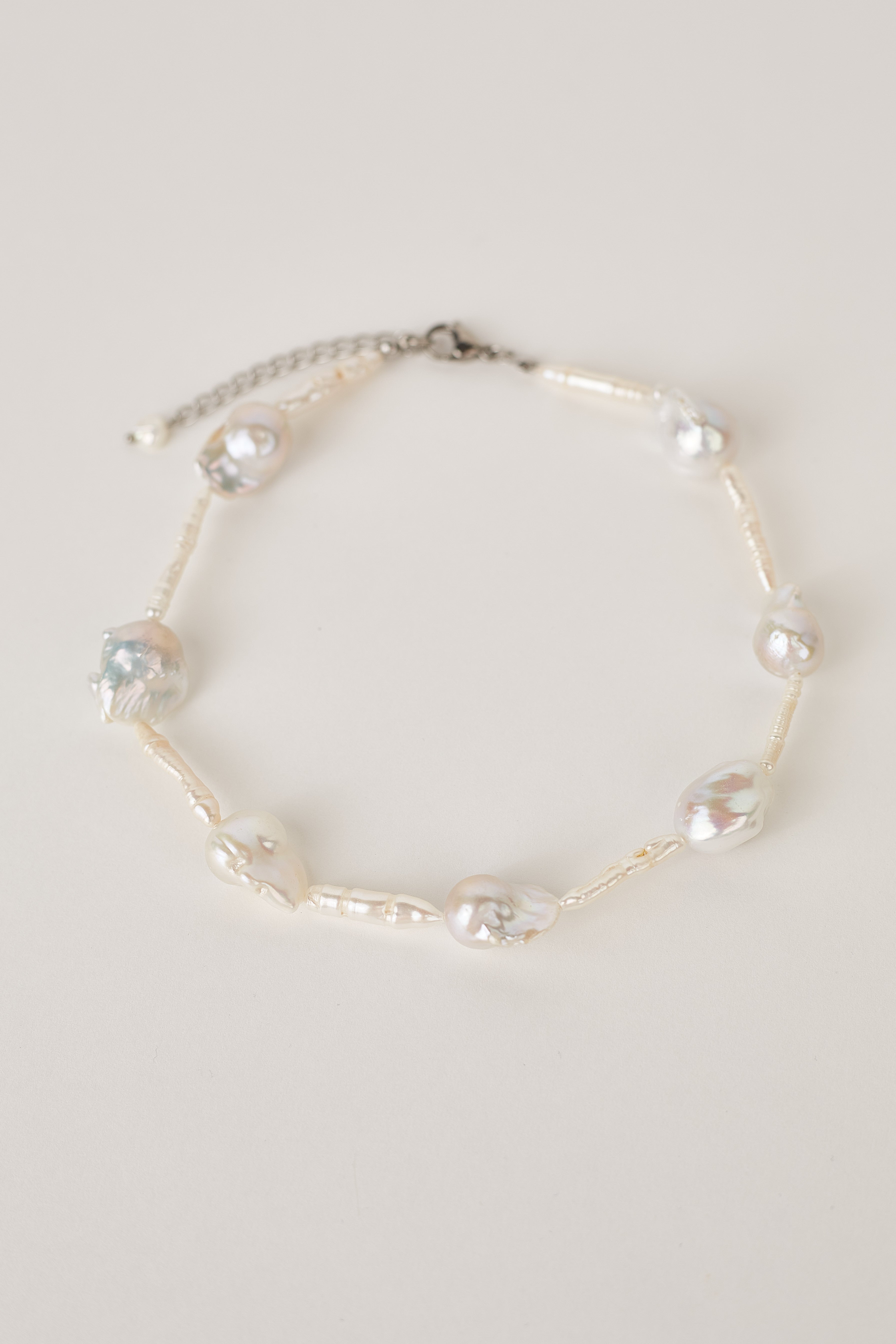 Natural freshwater pearl necklace in white background with silver clasp