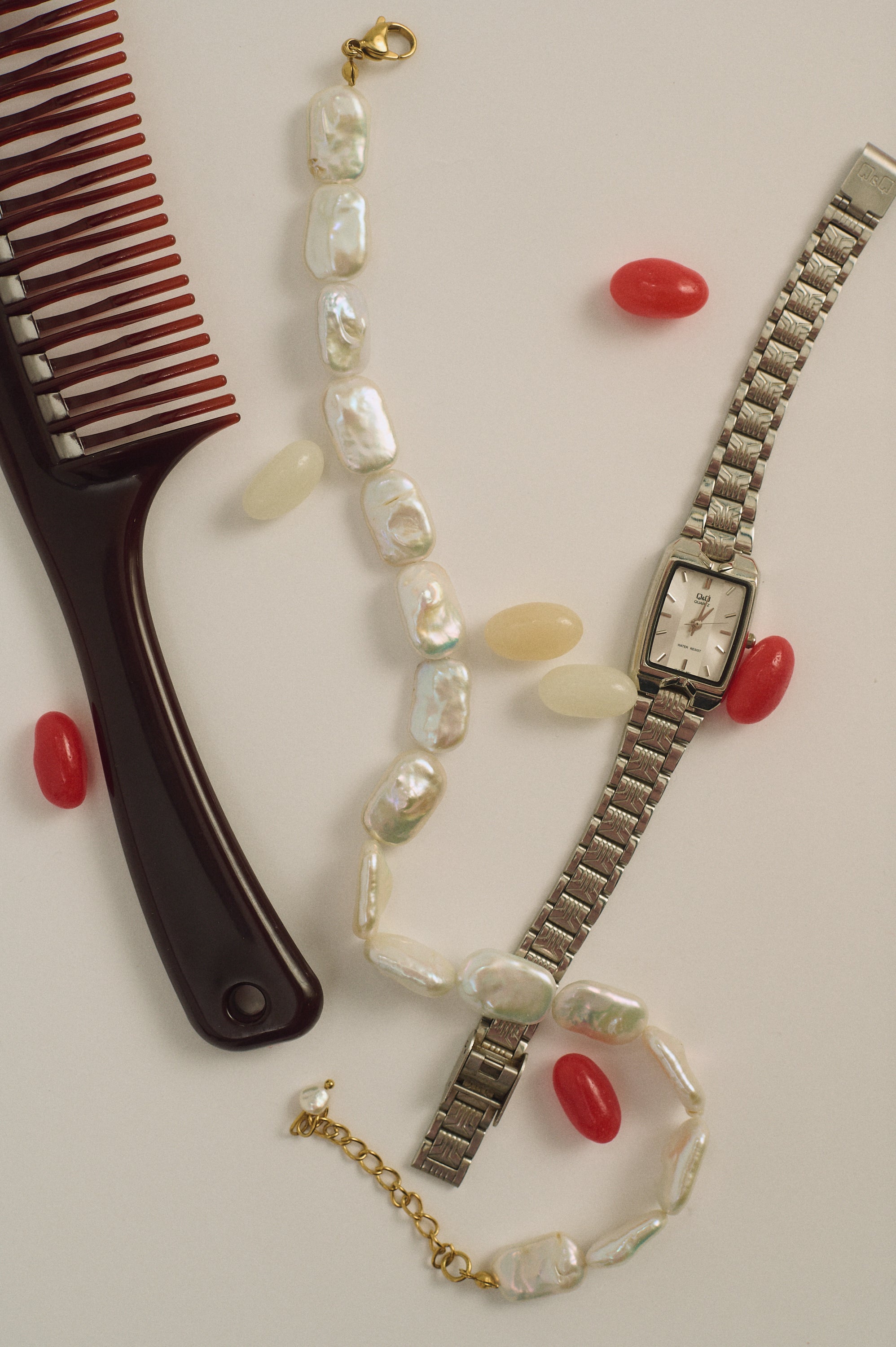 Flat rectangle natural pearl choker styled with watch