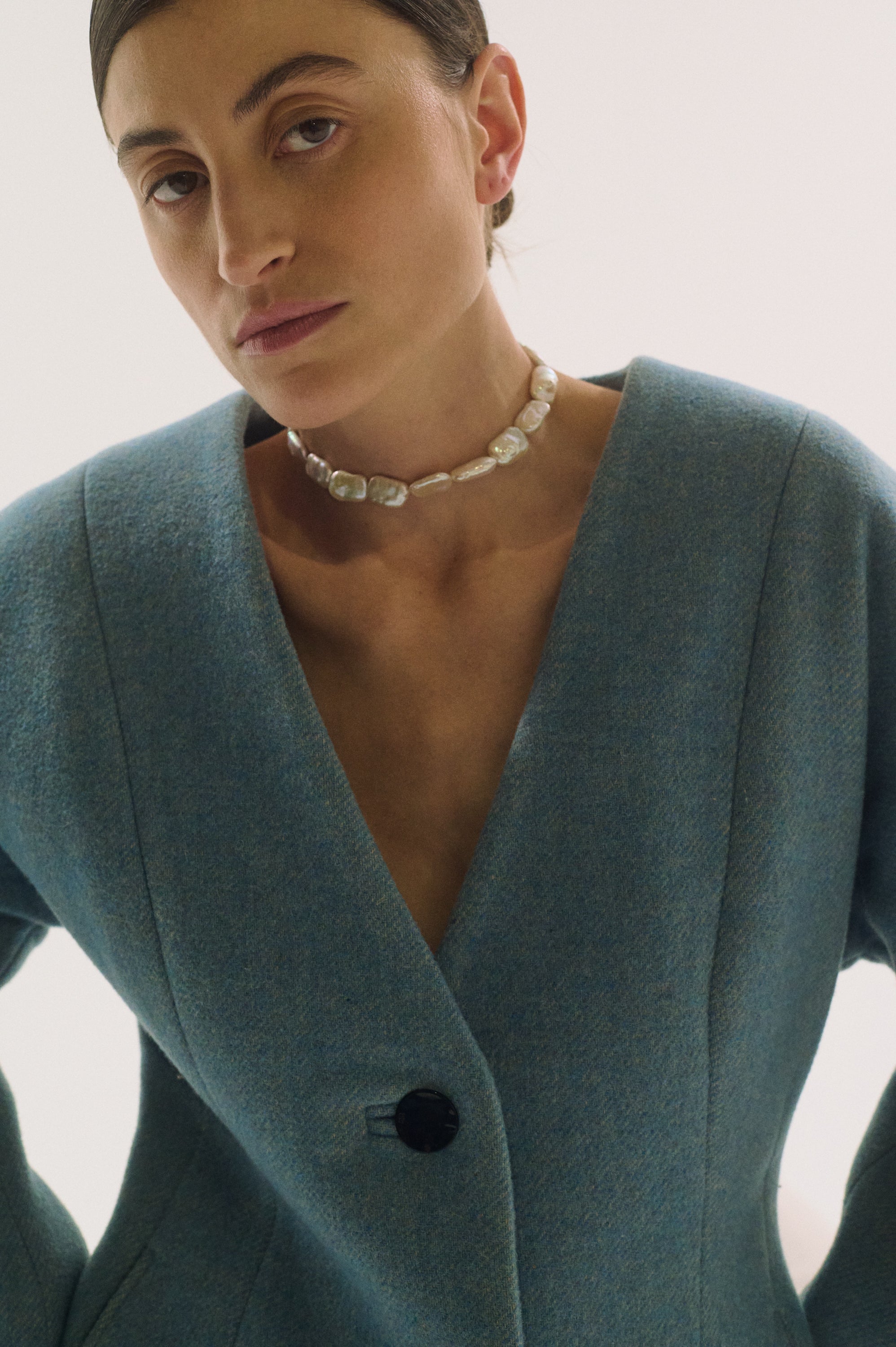 UGNÈS STORY flat rectangle pearl choker styled with blue jacket