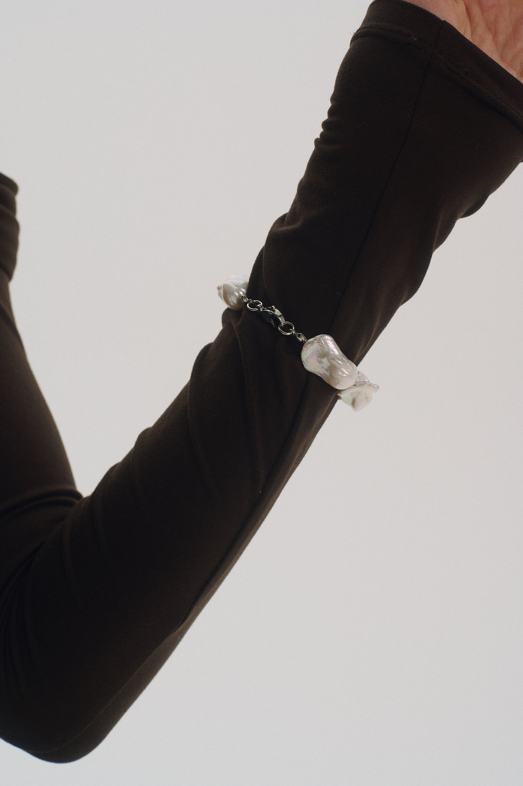 Back view showing large white baroque pearls on bracelet