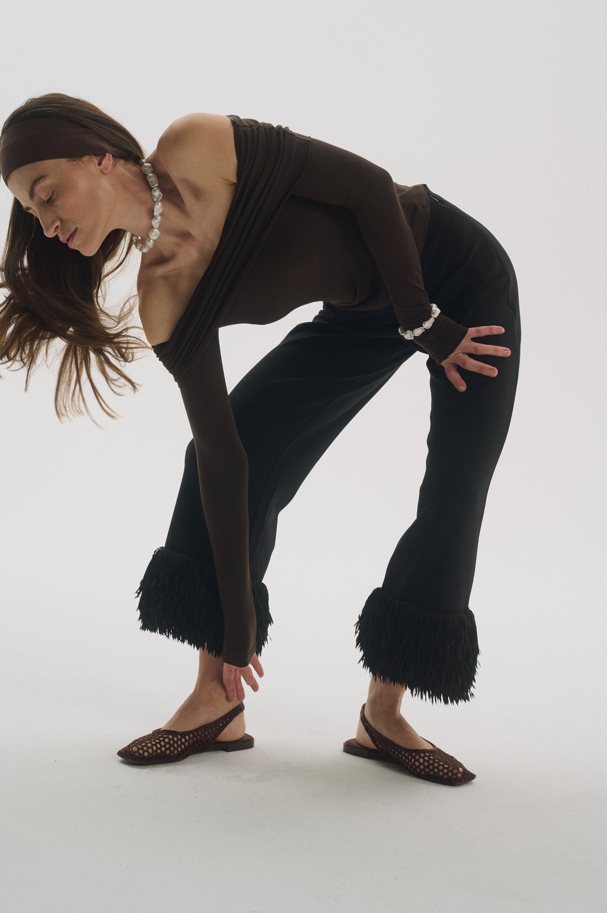 Close-up of silver clasp large baroque pearl bracelet on wrist