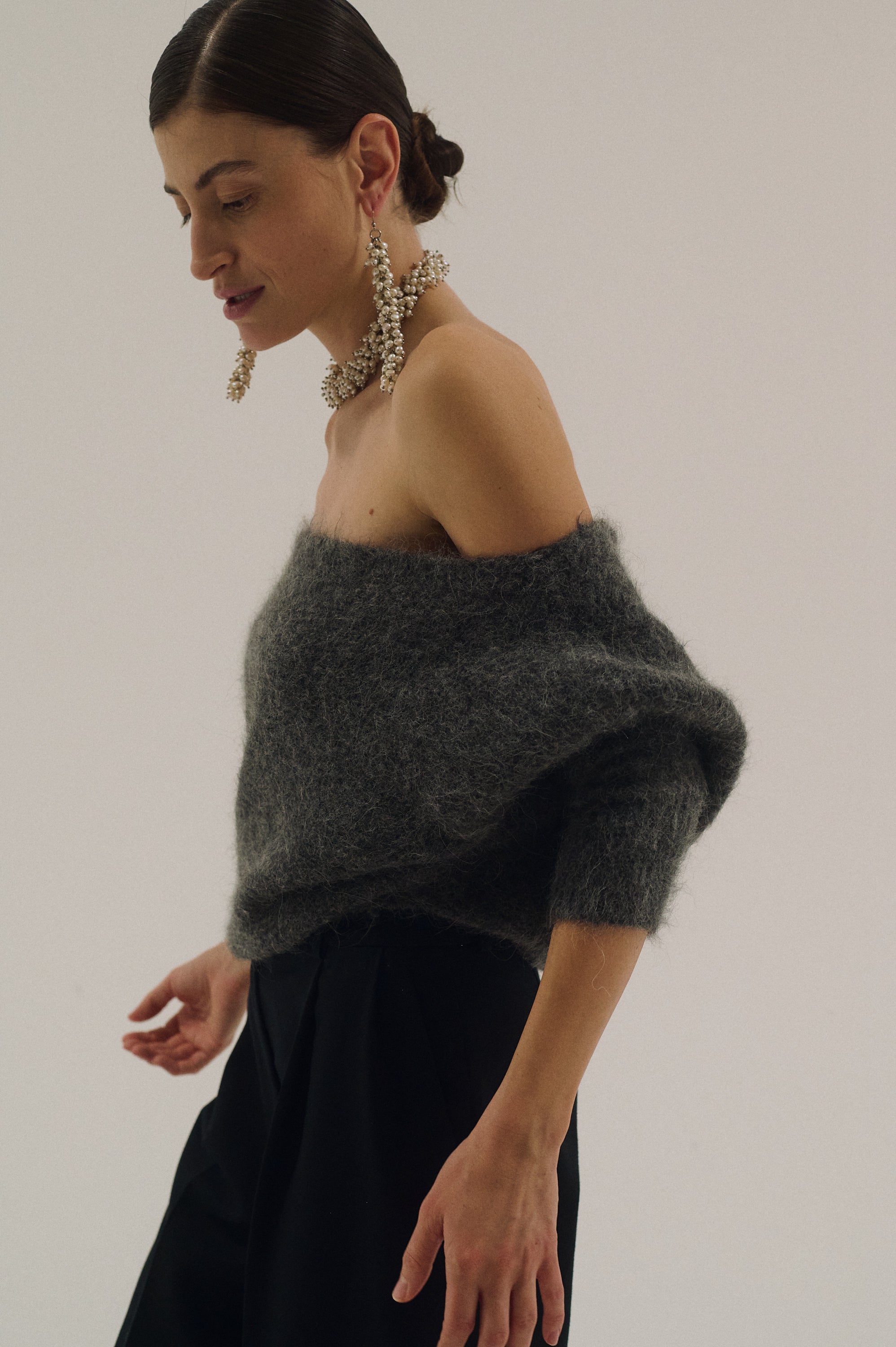 Statement pearl earrings styled with matching massive pearl choker necklace