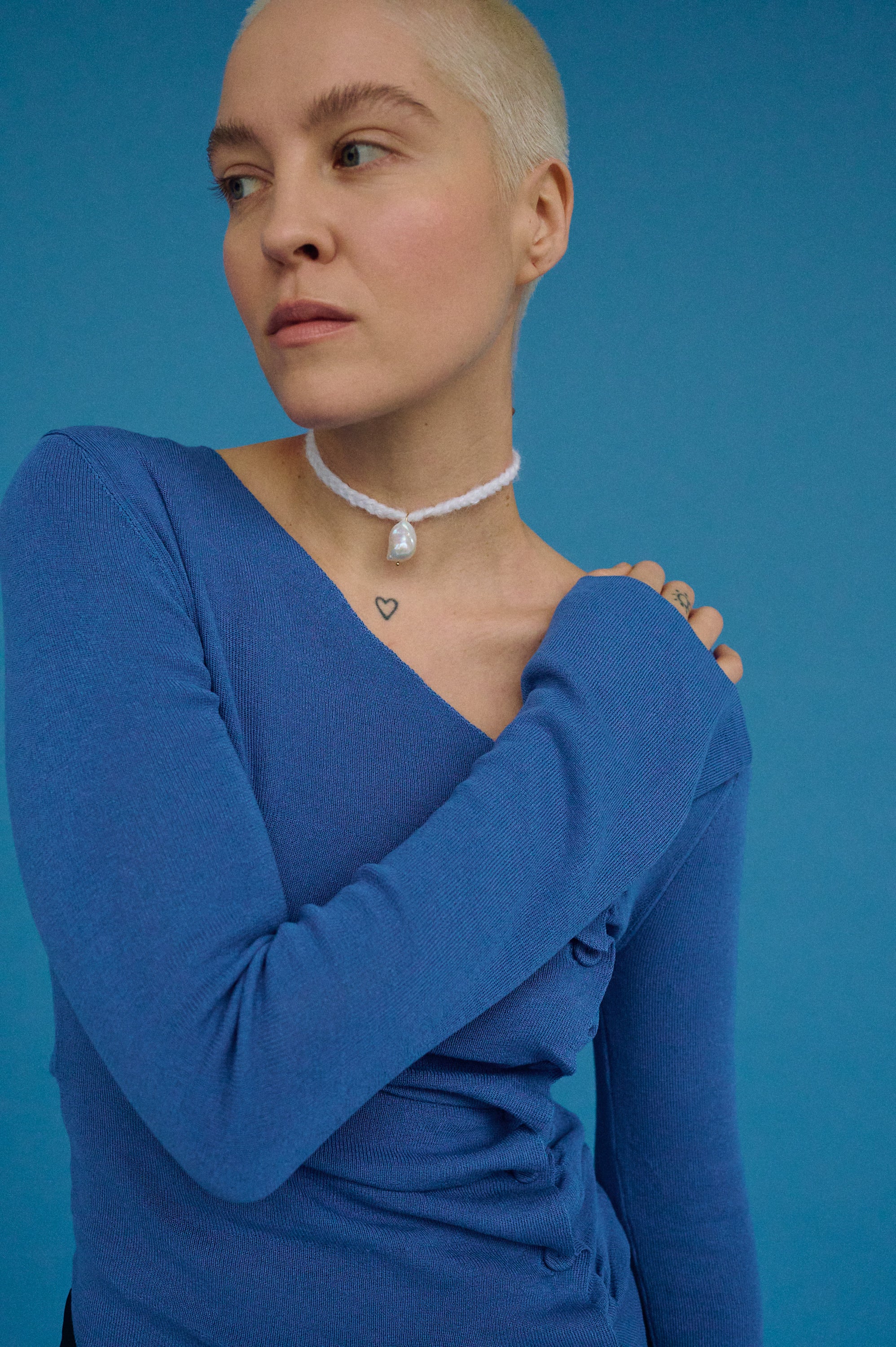 Statement mohair wool pearl choker styled on model – bold modern jewelry.