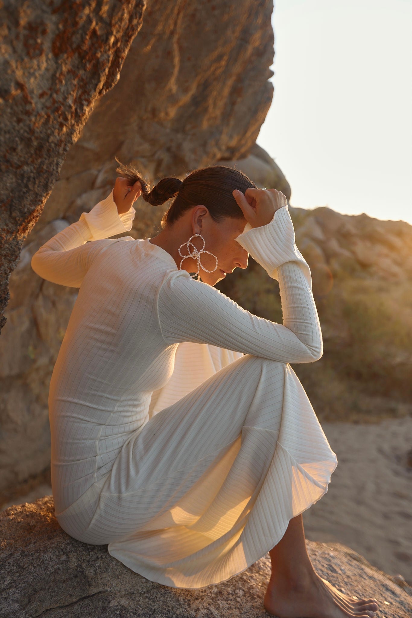 dramatic oversized earrings with beaded pearl design