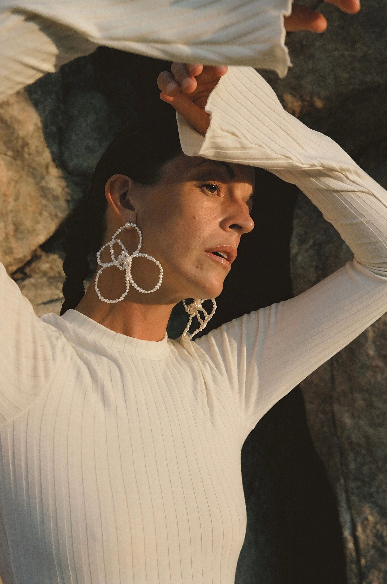 bold statement floral pearl earrings in evening light