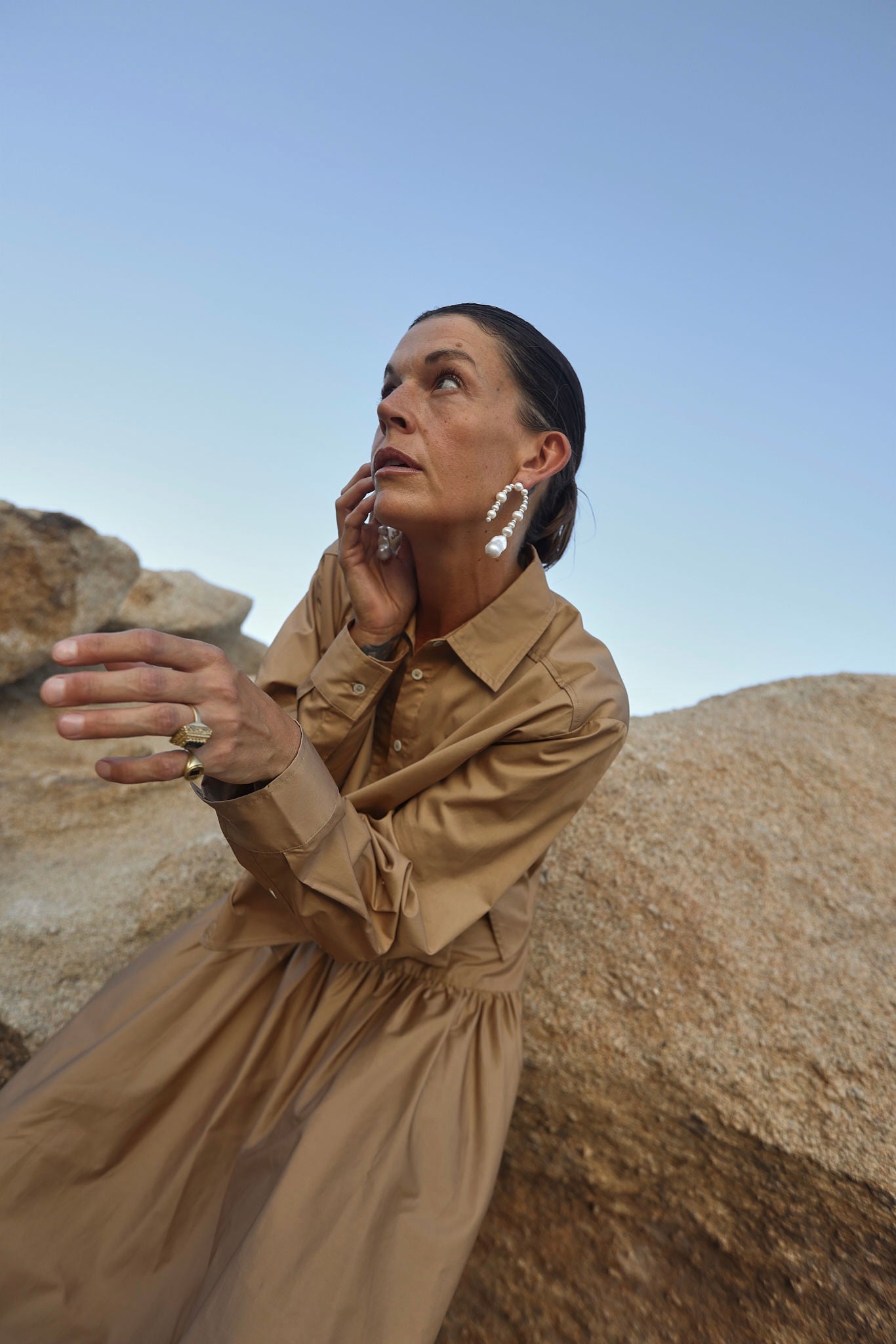 Pearl statement earrings styled with earthy fashion tones