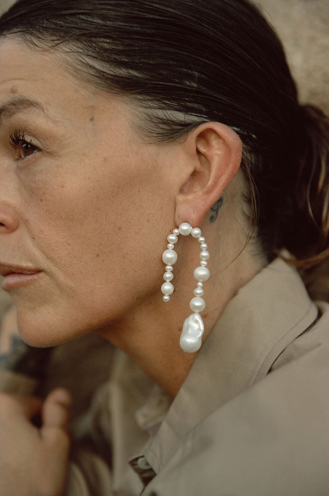 Natural freshwater pearl dangle earrings styled with neutral outfit