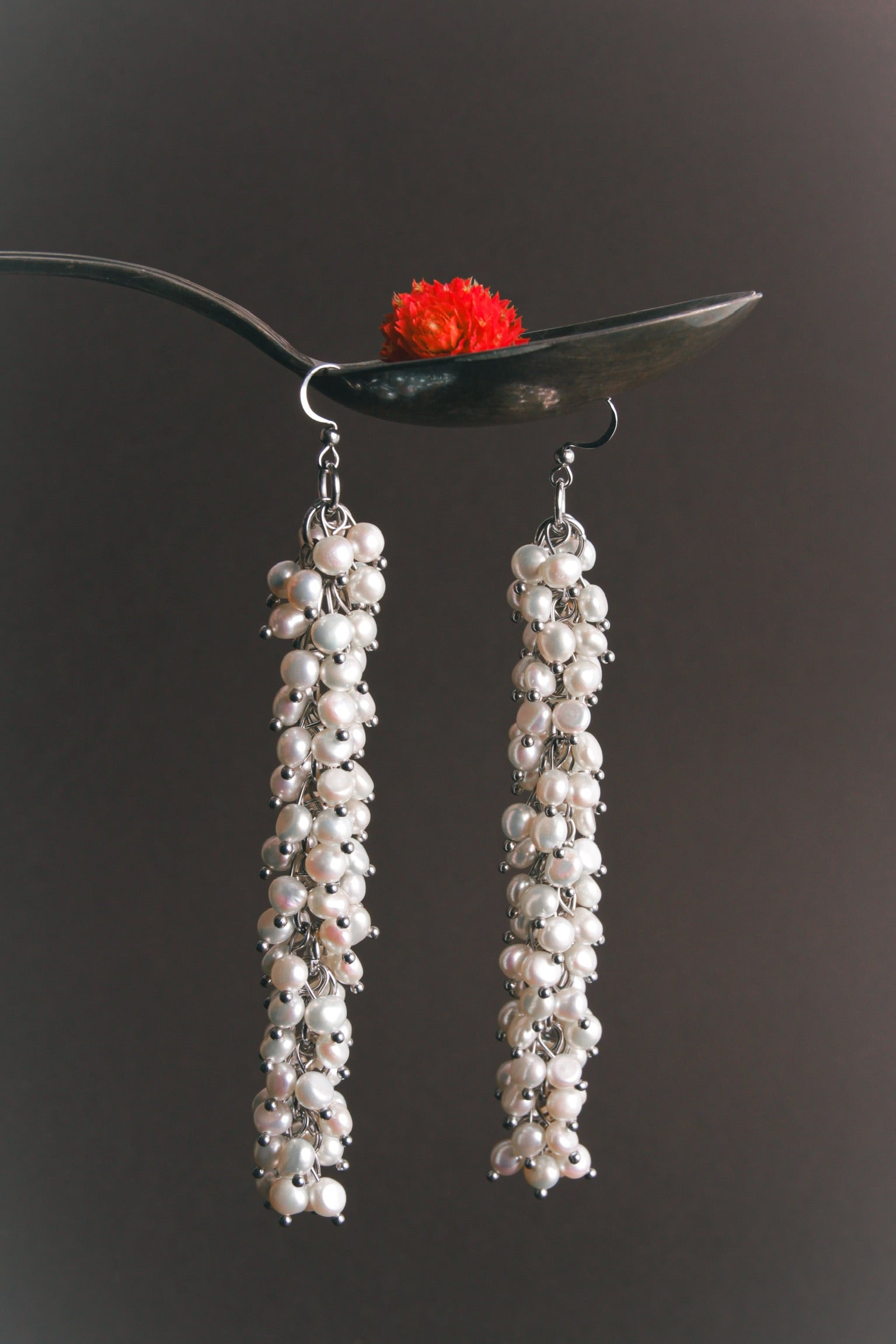Massive statement pearl earrings with clustered freshwater pearls on silver hooks