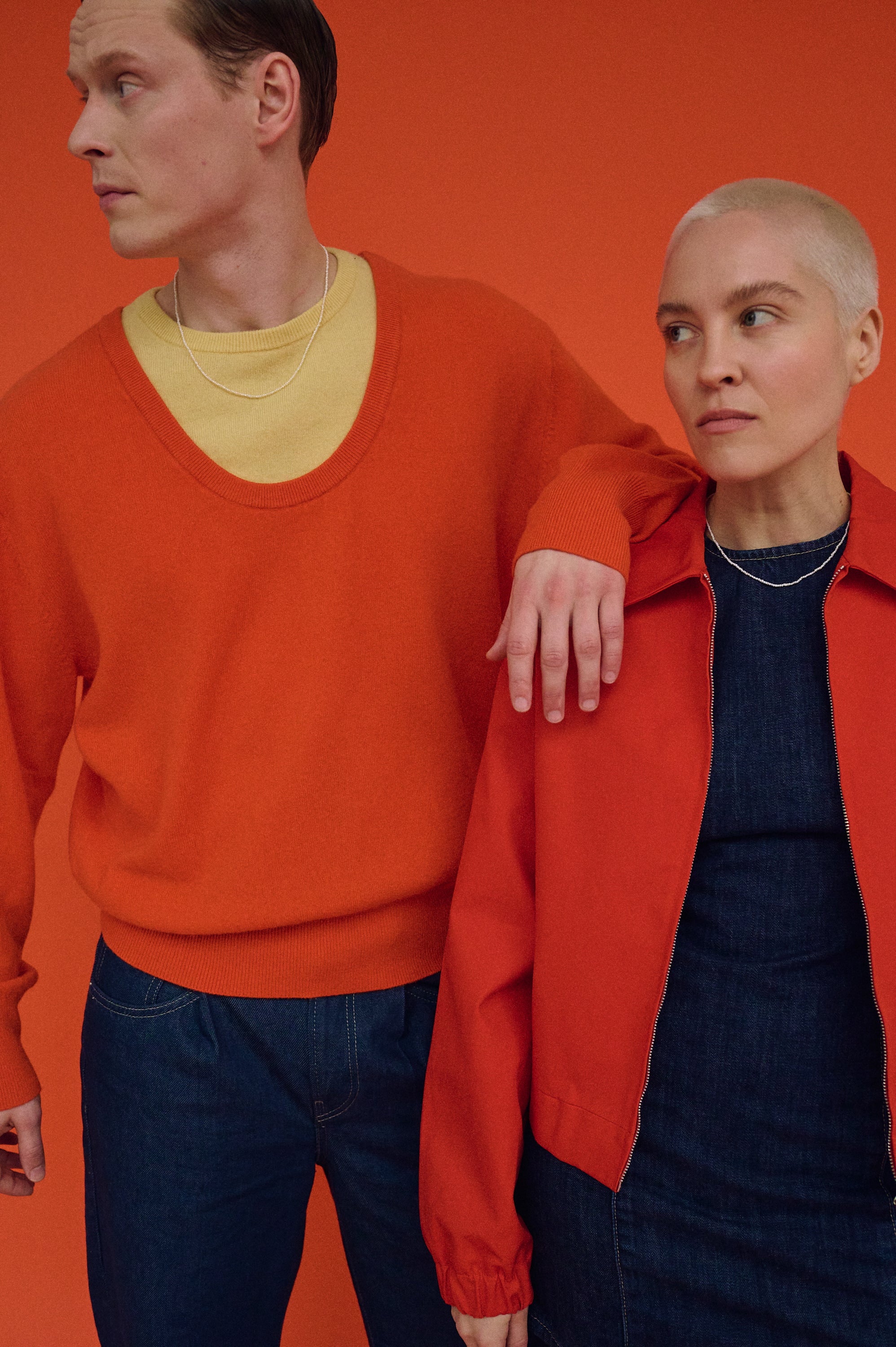 Couple wearing matching tiny pearl necklaces