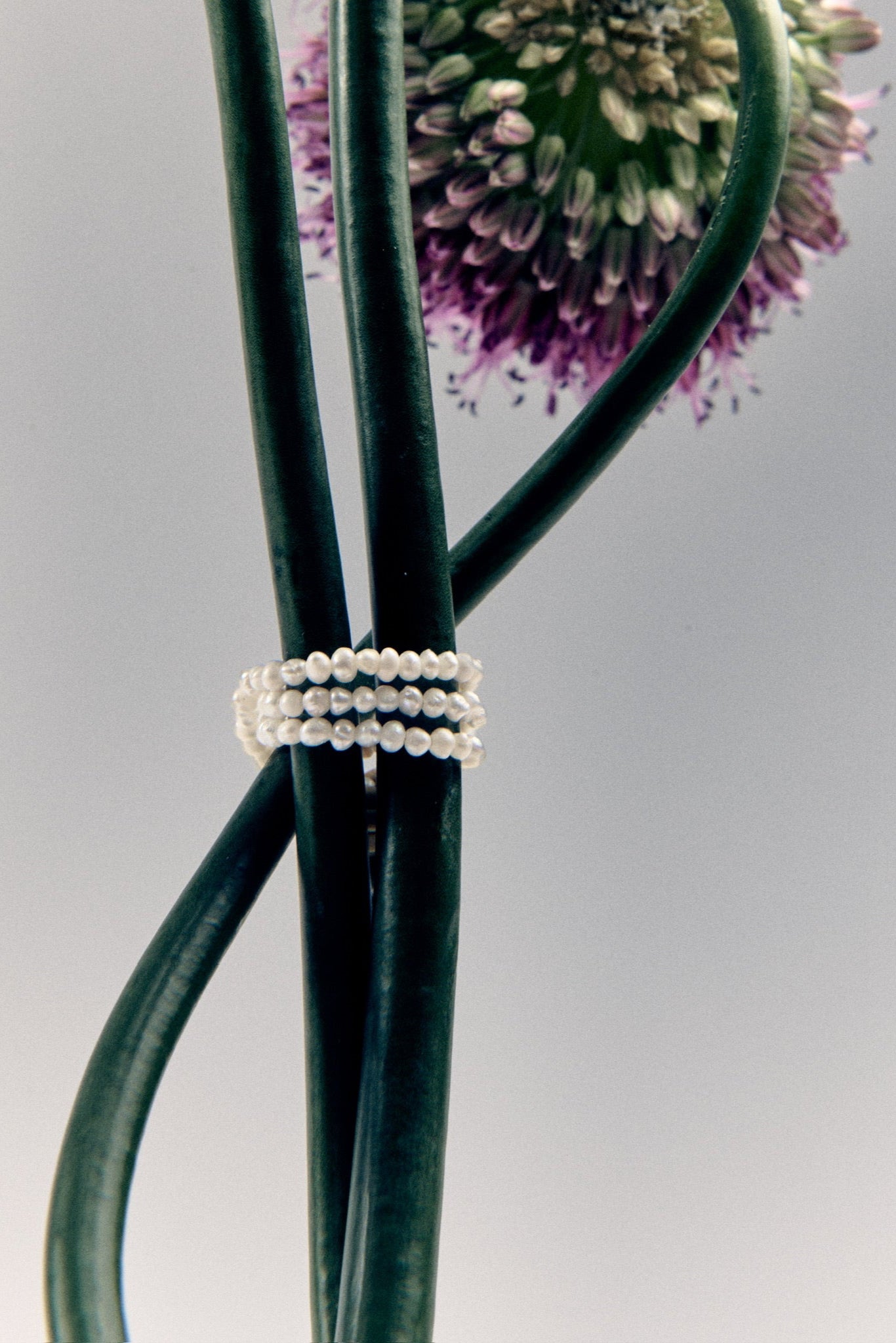 Handmade dainty pearl necklace close-up – luxury minimalist jewelry