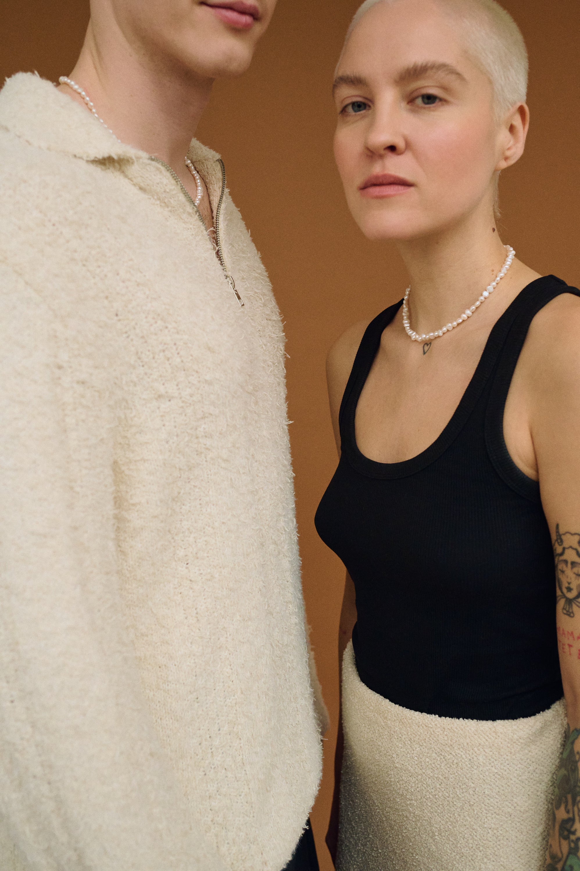 Close-up of real white freshwater pearl choker on woman