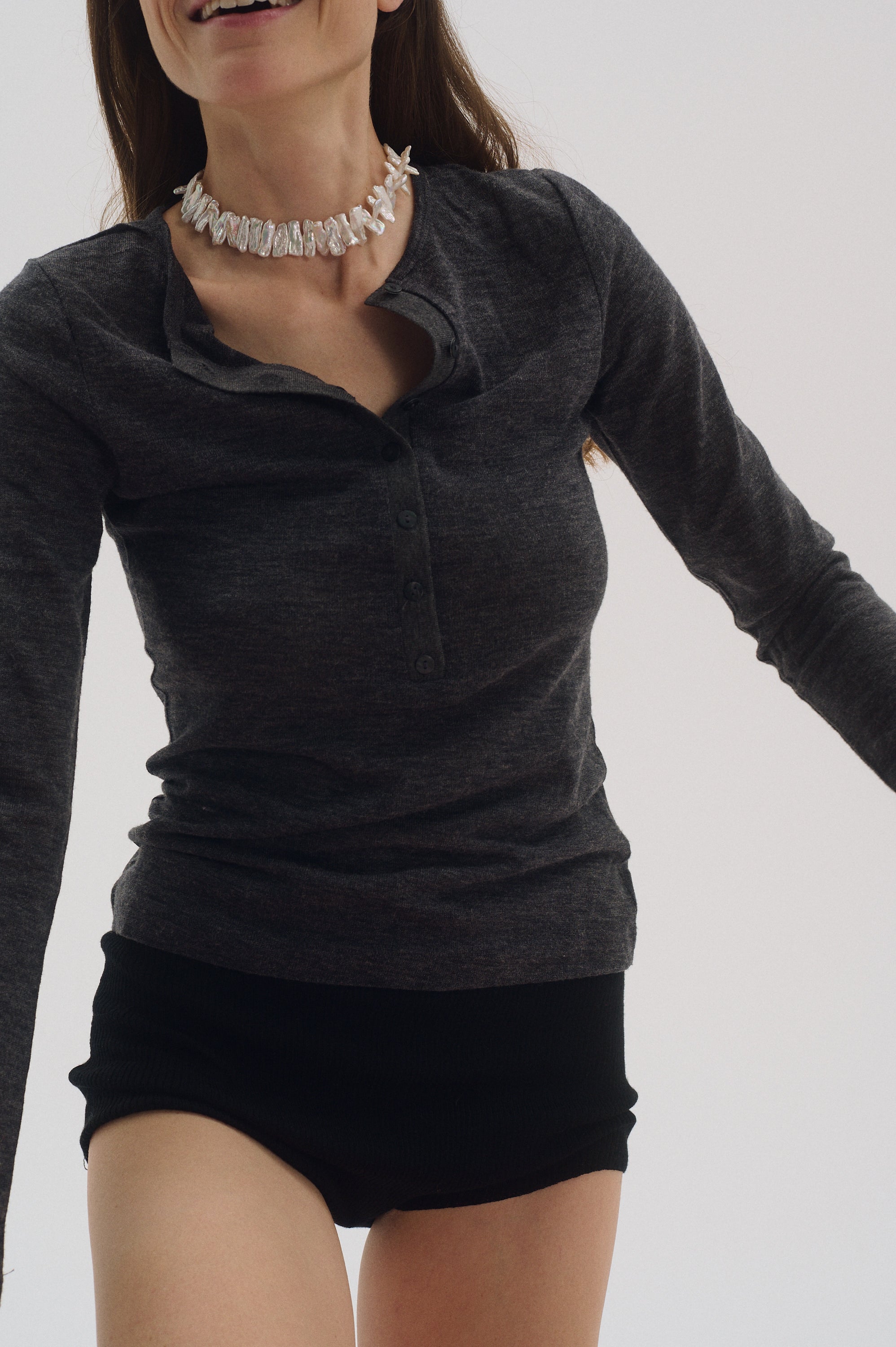 Woman modeling bold white Keshi pearl choker necklace.