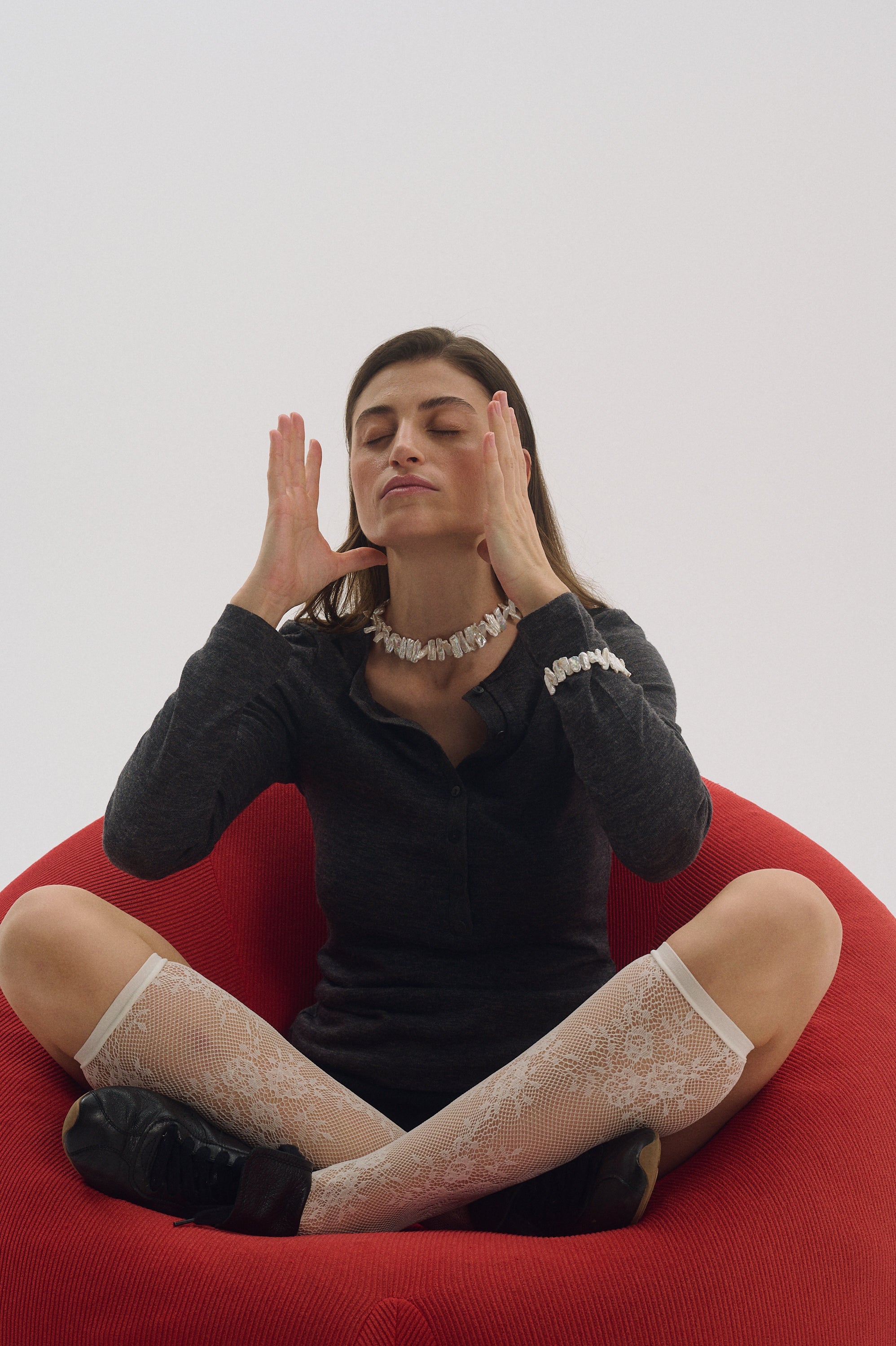 Bold white Keshi pearl necklace styled with dark grey top.