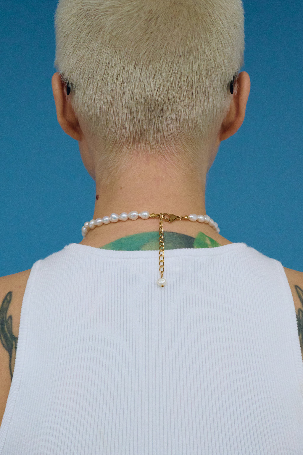 Close-up of baroque teardrop pearl necklace with gold clasp