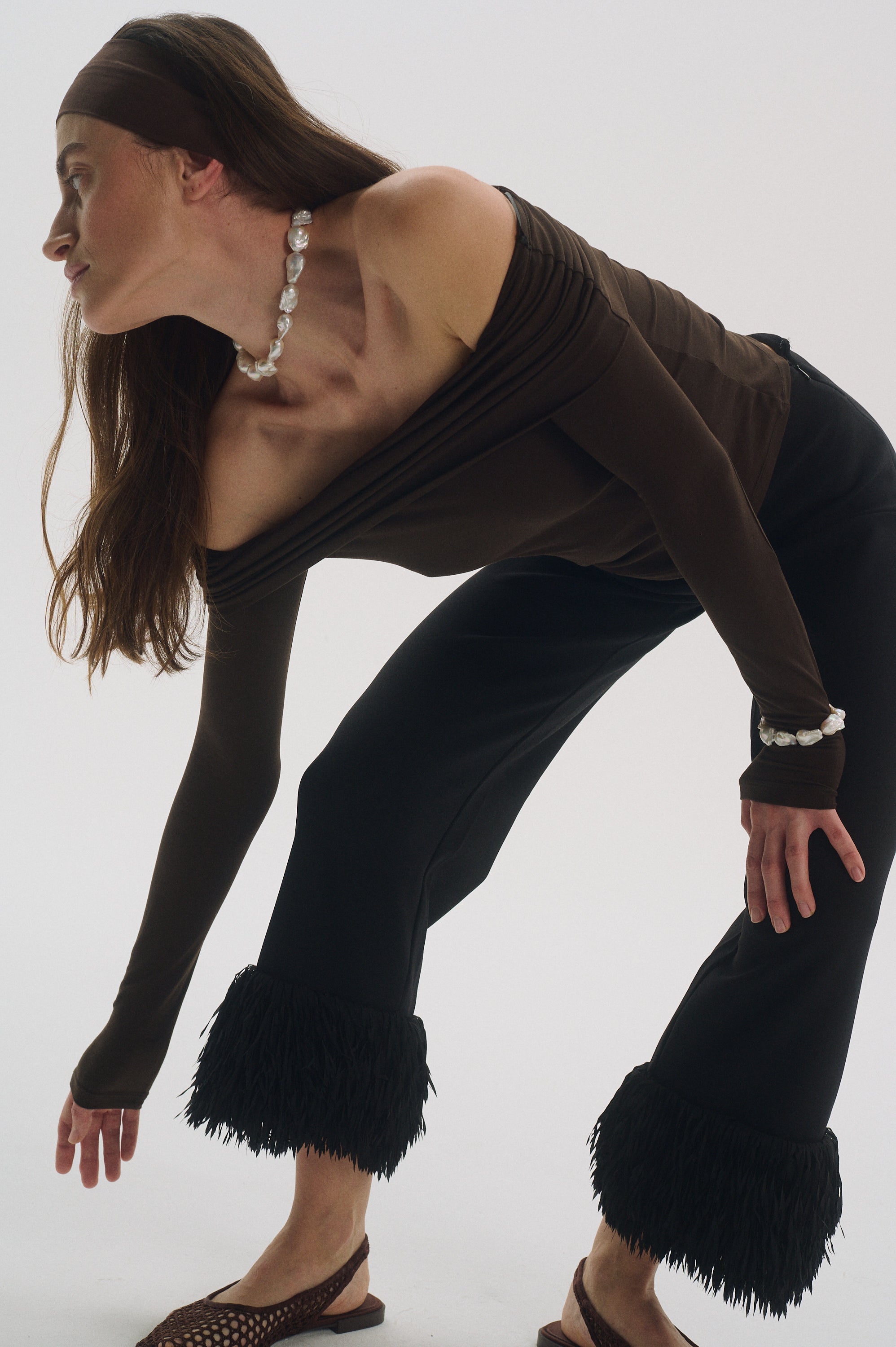 Model wearing massive baroque pearl necklace and bracelet set