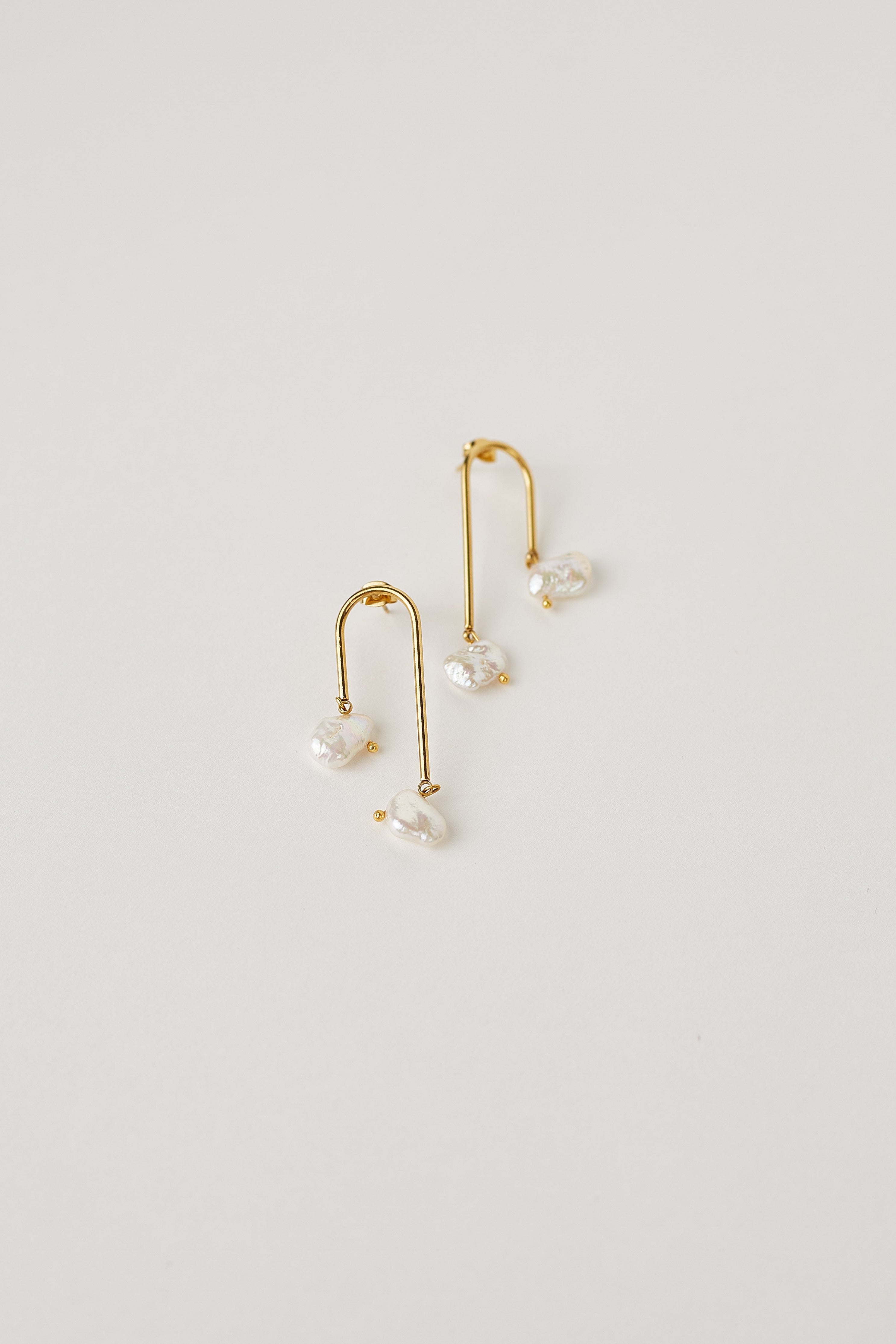 Gold dangling Keshi pearl earrings with natural pearls