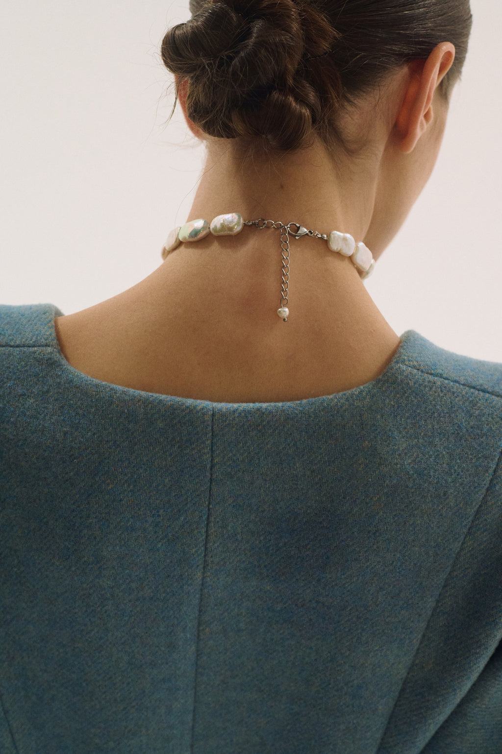 Back view of flat rectangle freshwater pearl choker with silver clasp and adjustable chain
