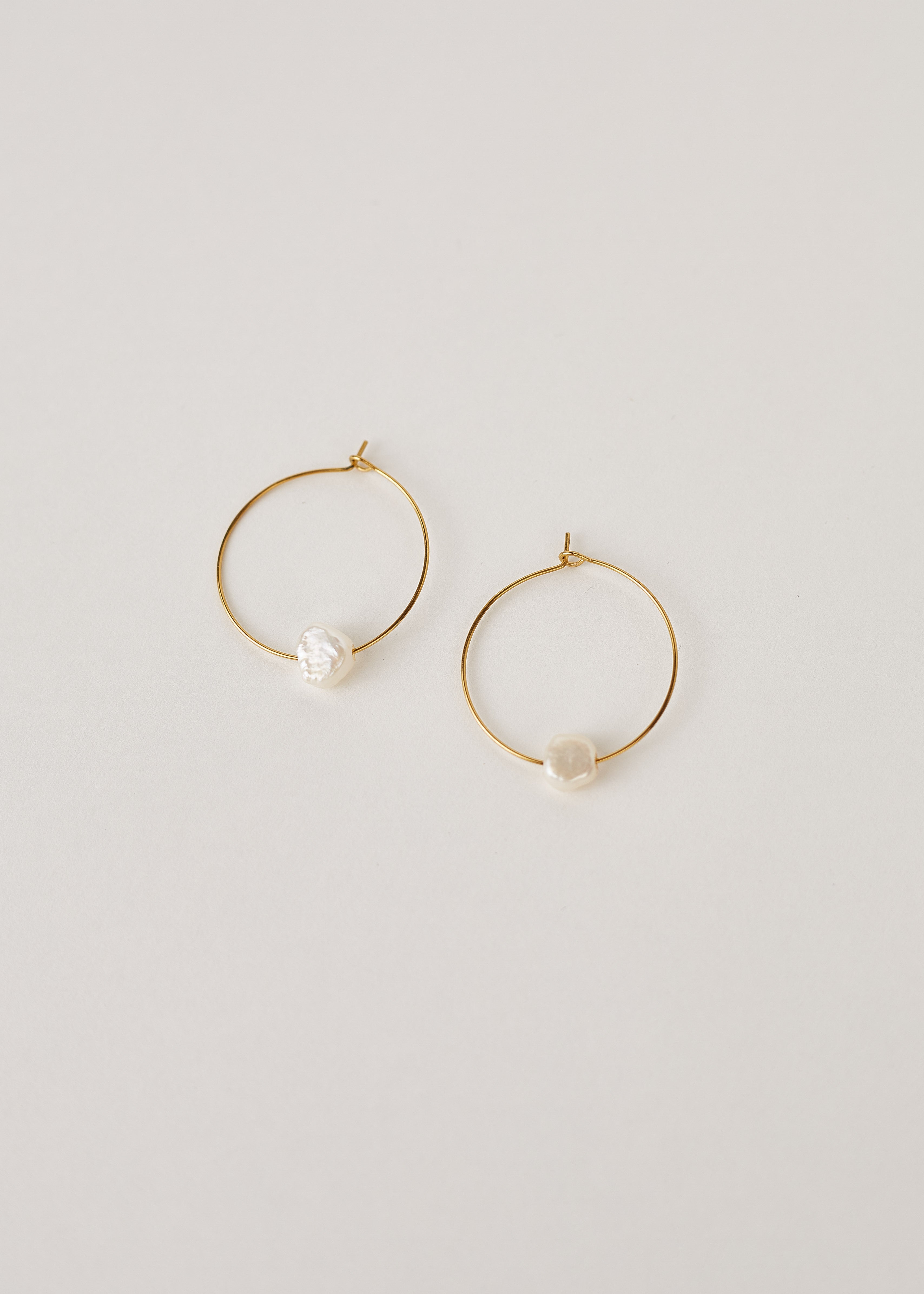 Gold hoop earrings with real pearls