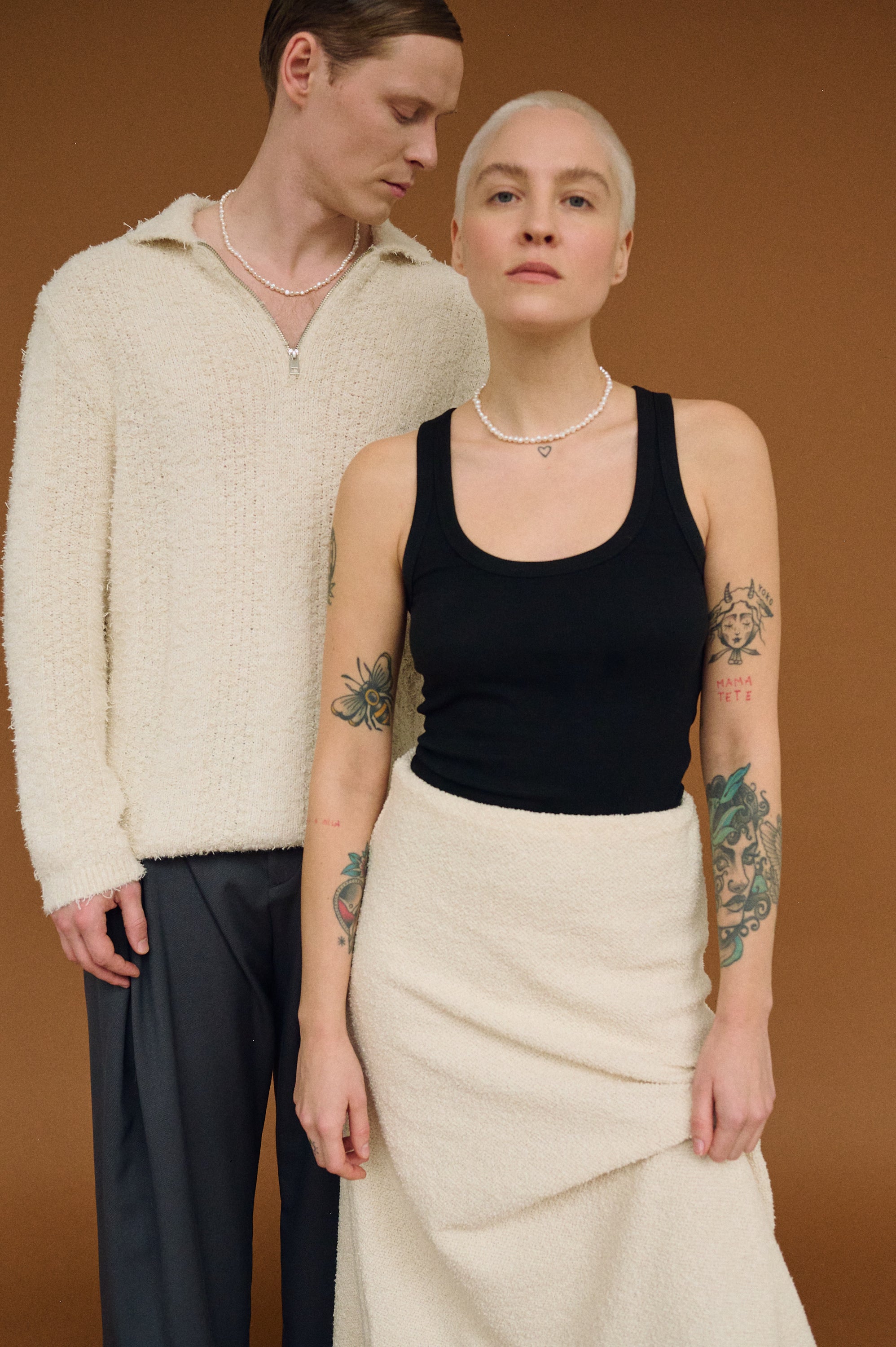 Couple wearing matching white freshwater pearl necklaces