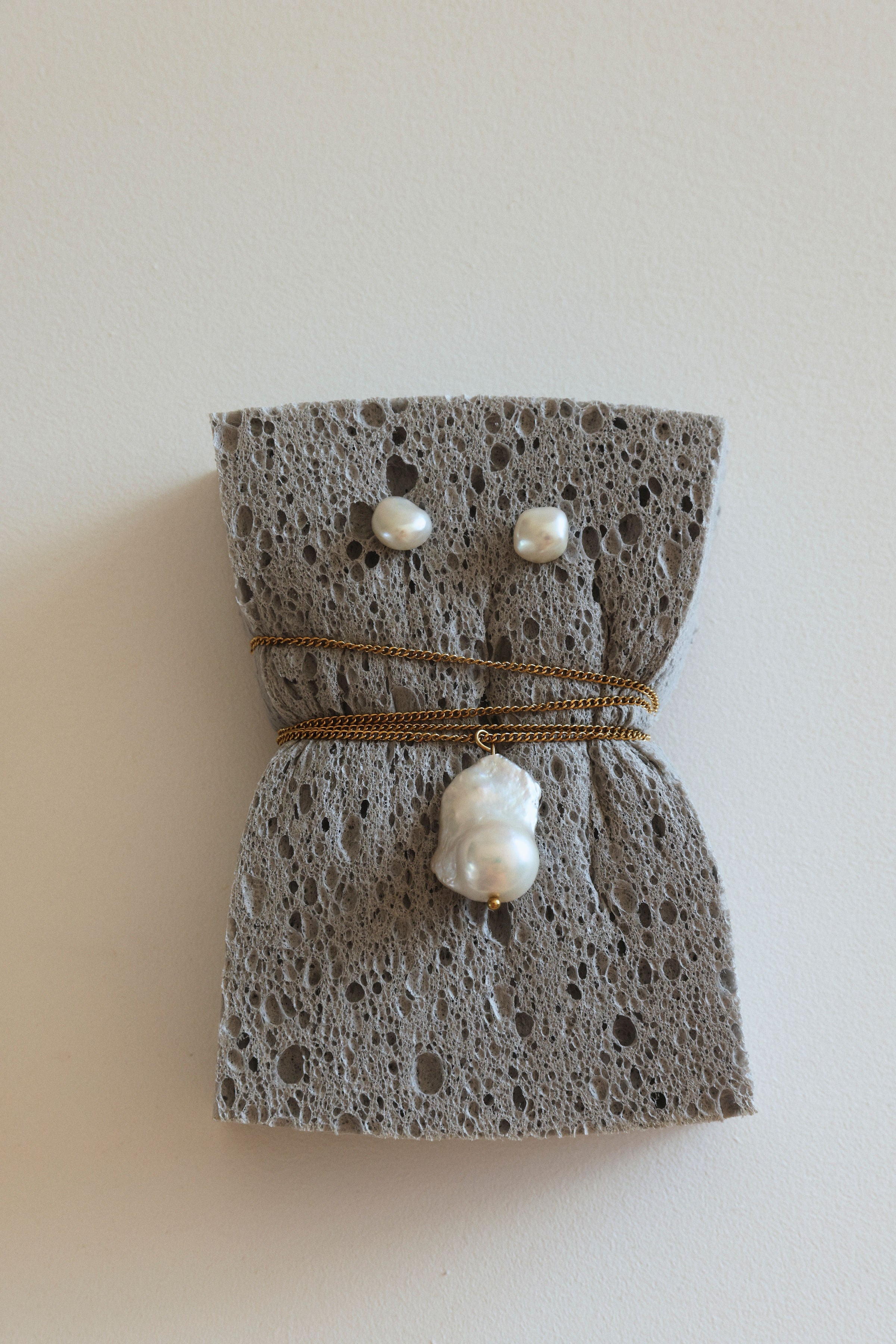 Modern handmade Keshi pearl earrings photographed in sunlight