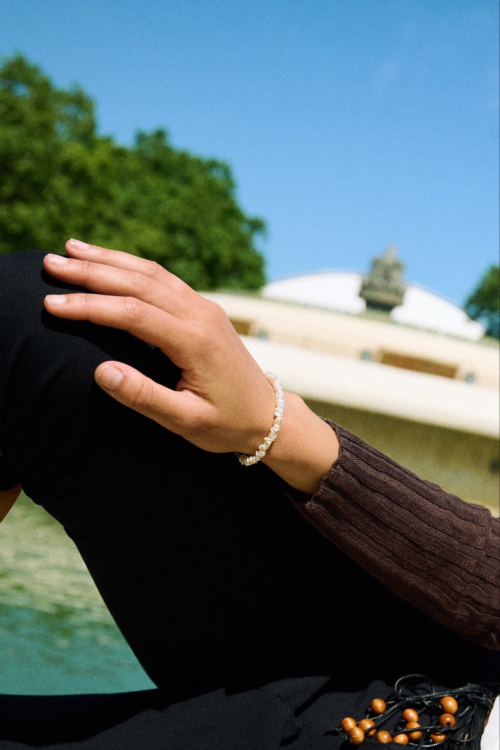 Close-up of a delicate white keshi pearl bracelet with small irregular freshwater pearls.