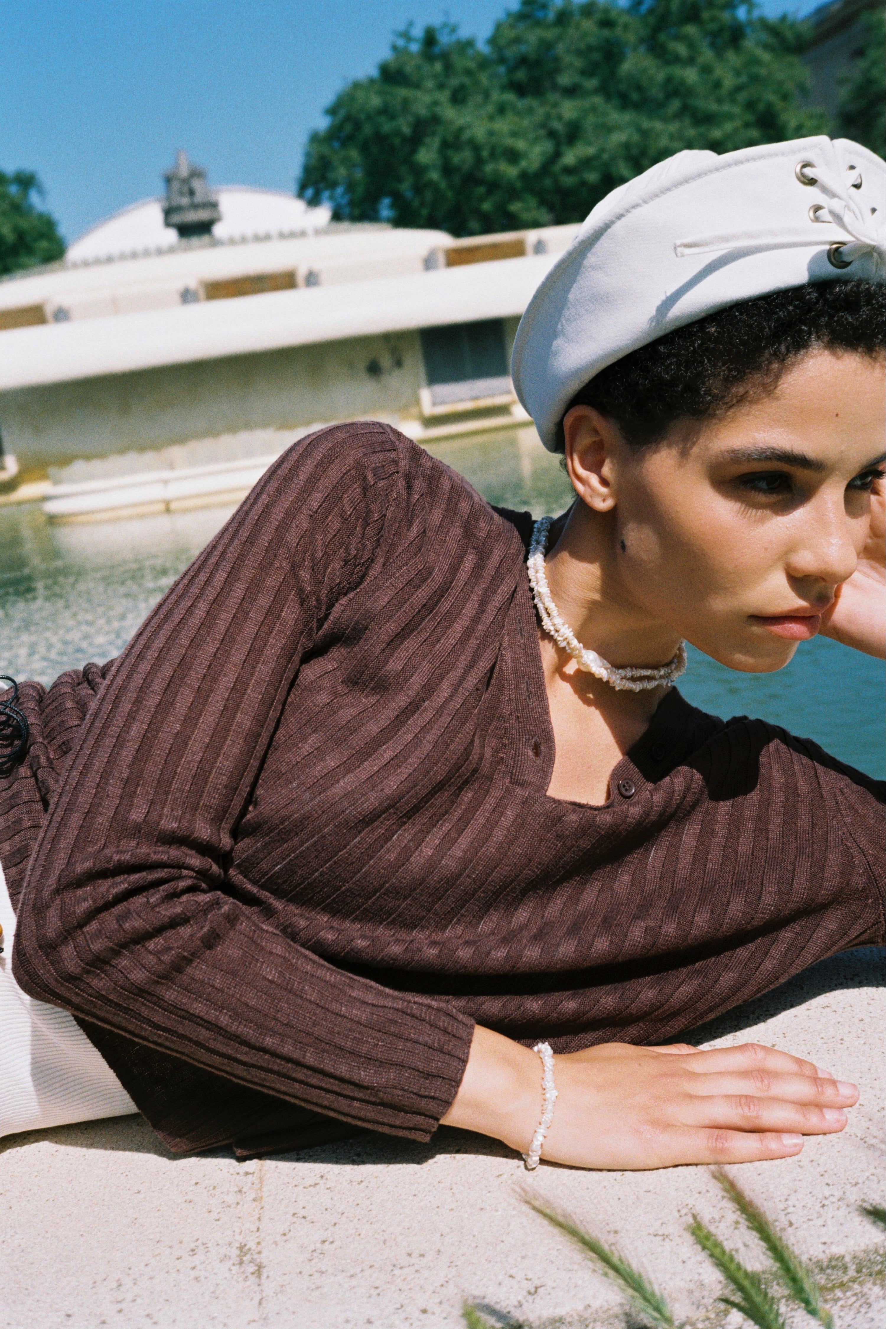 Model wearing a matching white keshi pearl choker and bracelet set.