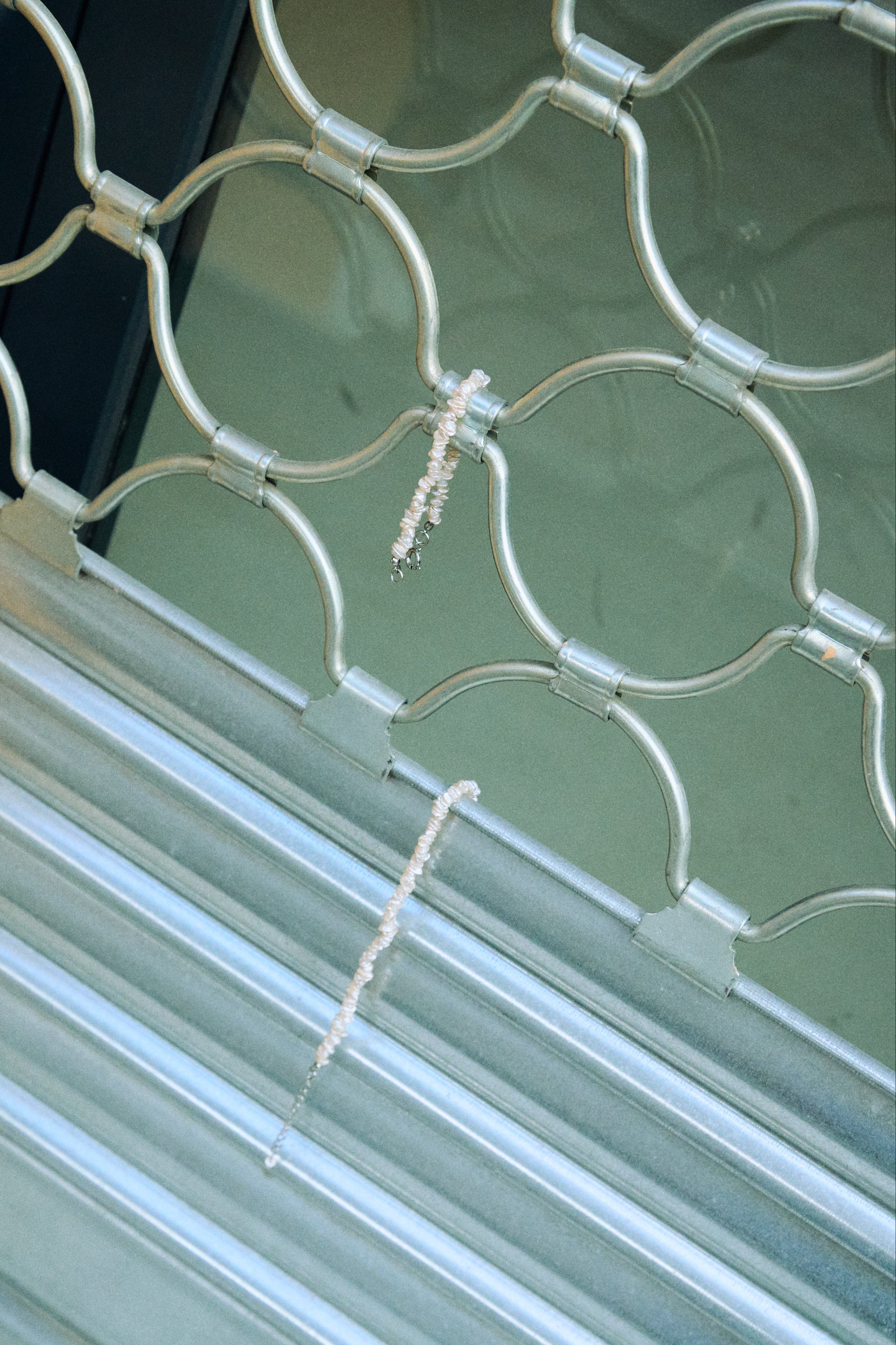 Matching white keshi pearl choker and bracelet set with PVD-coated stainless steel clasps.