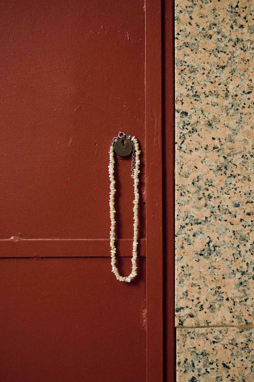 Close-up of a white keshi freshwater pearl necklace with small irregular pearls.