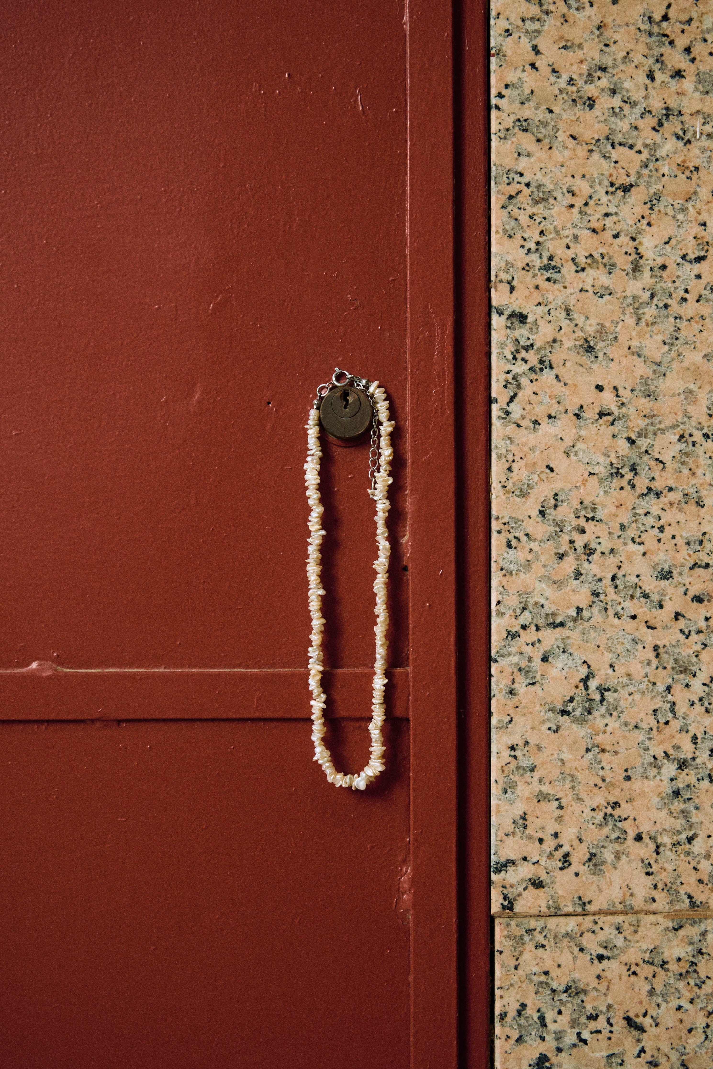 Close-up of a white keshi freshwater pearl necklace with small irregular pearls.